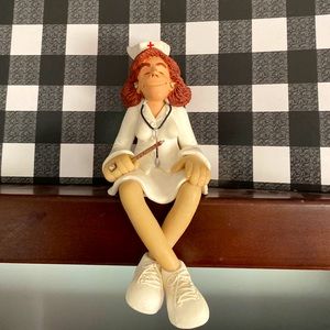 D. Manning Rare nurse shelf sitter